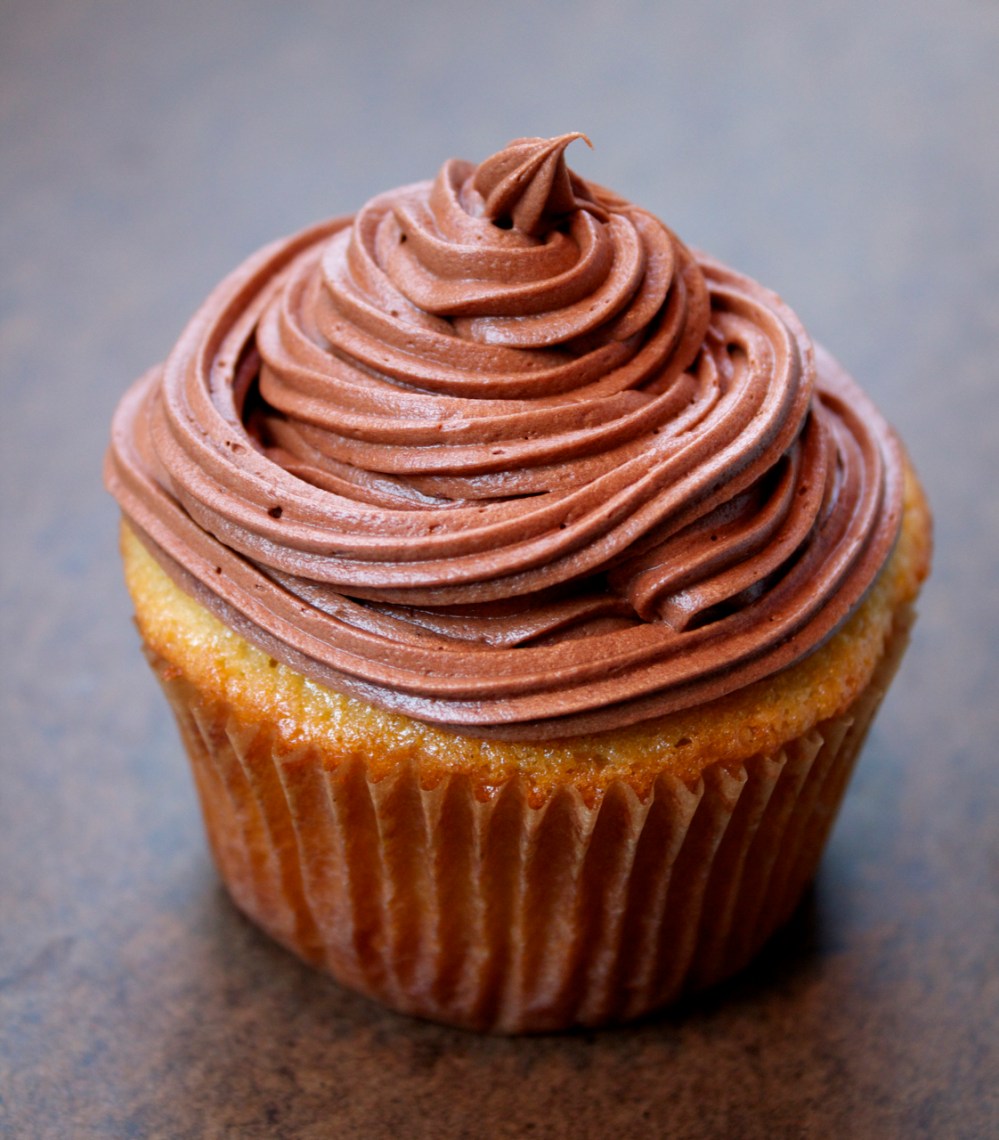 Chocolate Frosting on a yellow cupcake